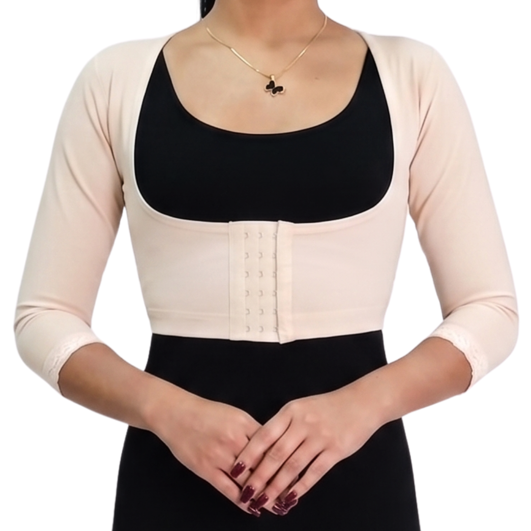 Faja torerita de alta compresión diseñada para recuperación postoperatoria de brazos. Fabricada con Powernet y Spandex, ayuda a reducir la hinchazón y moldear. Cuenta con gafetes para ajuste y encaje decorativo. Ideal para confort y soporte en tu recuperación.
